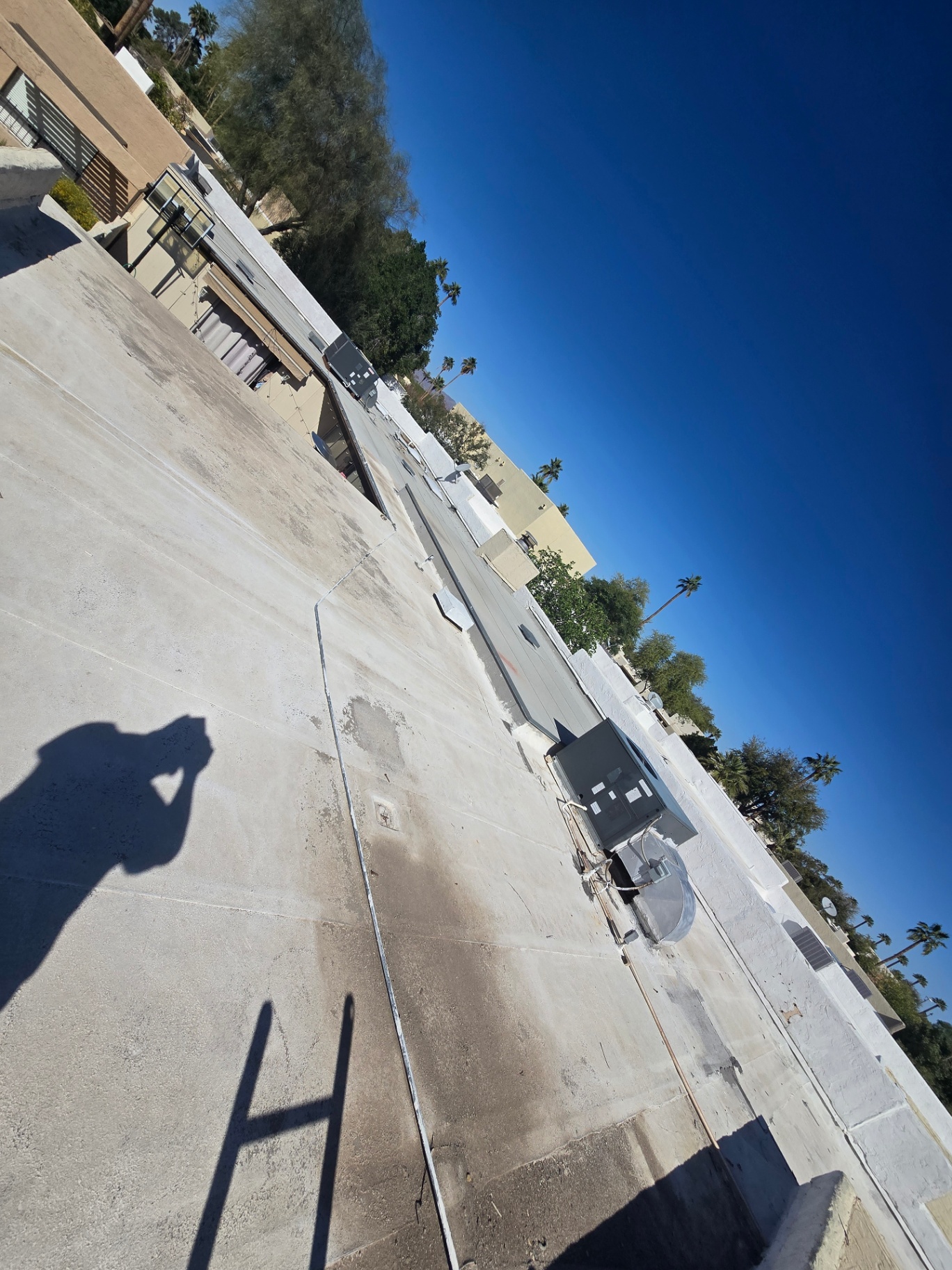 Concrete flat roof deck prepped and cleaned before new membrane install