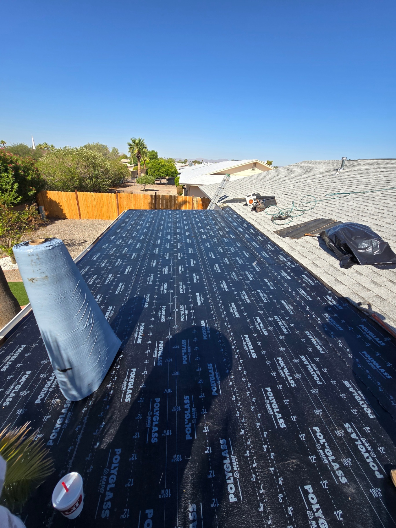 Patio cover with Polyglass base sheet tied into adjacent shingle roof
