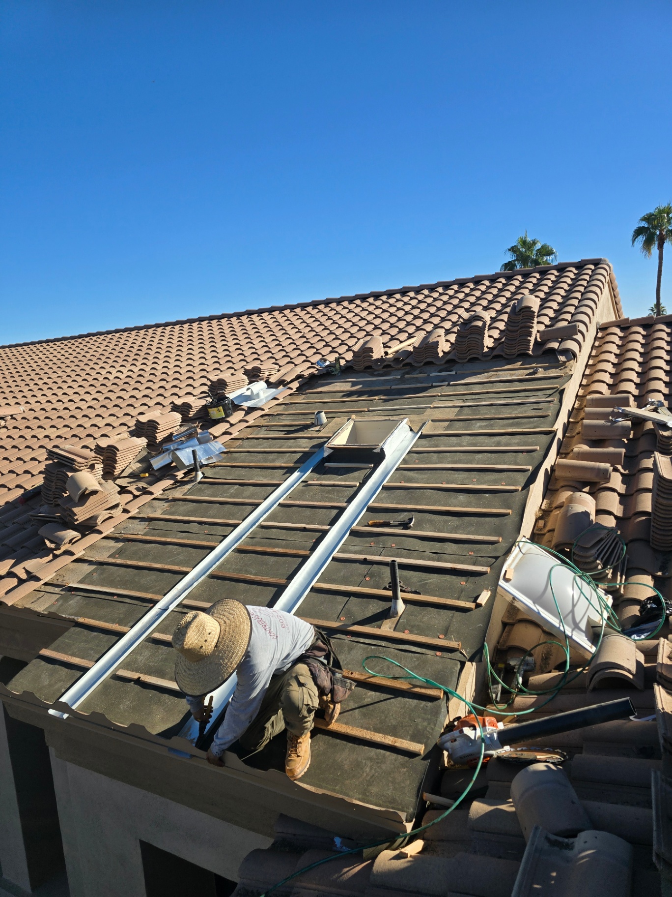 Full tile lift and re-deck with new underlayment and battens during a major repair