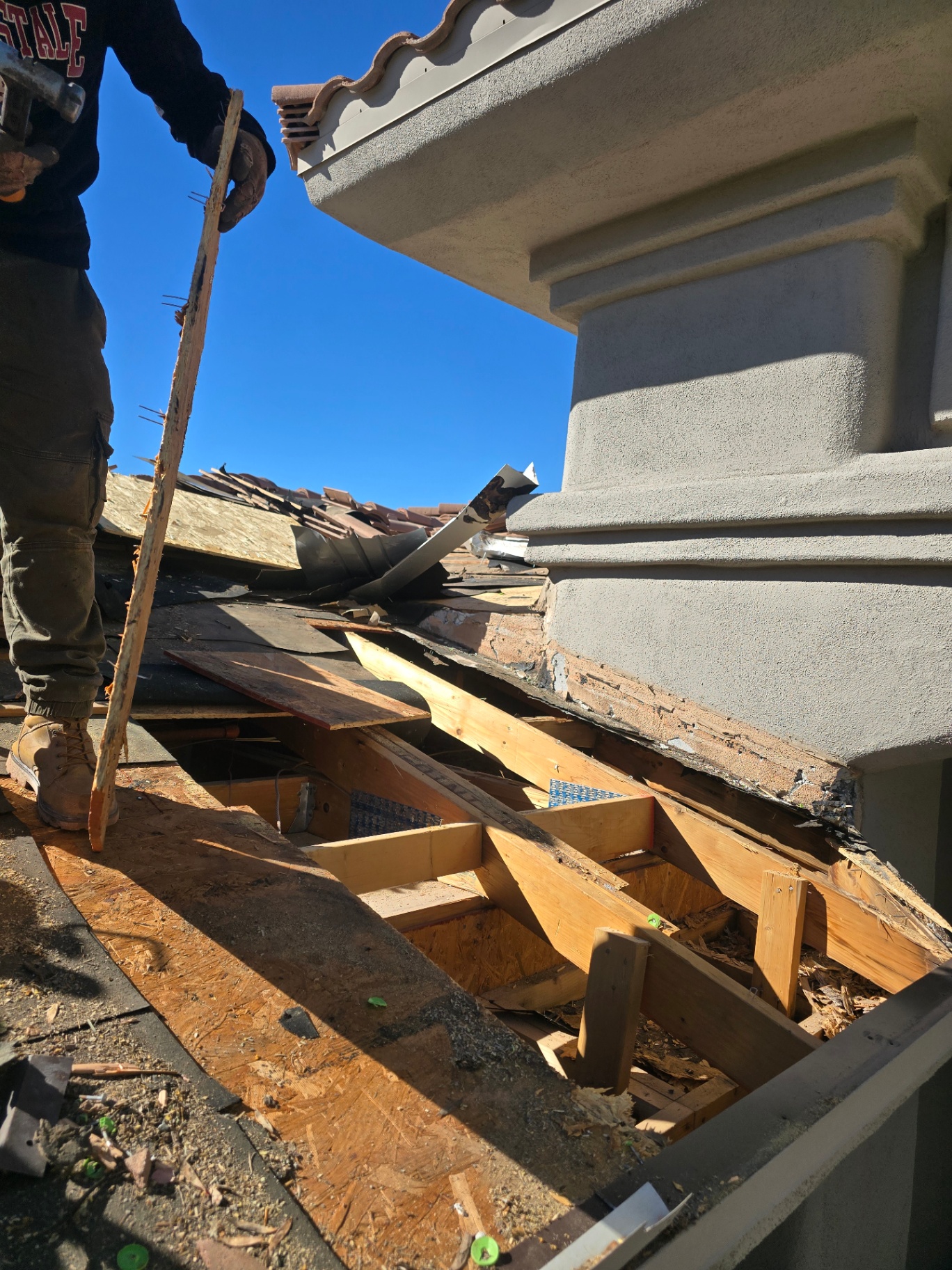 Tear-out of rotted patio decking and rafters to access and repair the leak source
